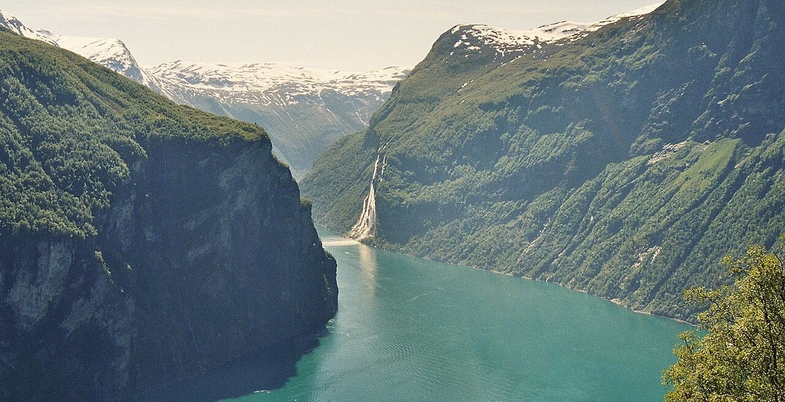 Geirangerfjord stretching between steep mountains and waterfalls